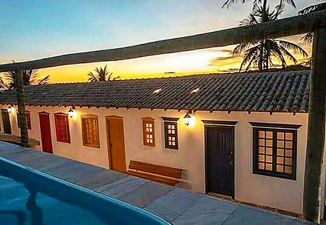 Apartamento em Guarapari - Suíte em pousada no ES com lazer completo e Wi-Fi